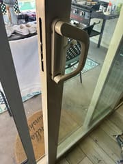 Breasy repairing exterior gate hardware at a Scottsdale HOA community home