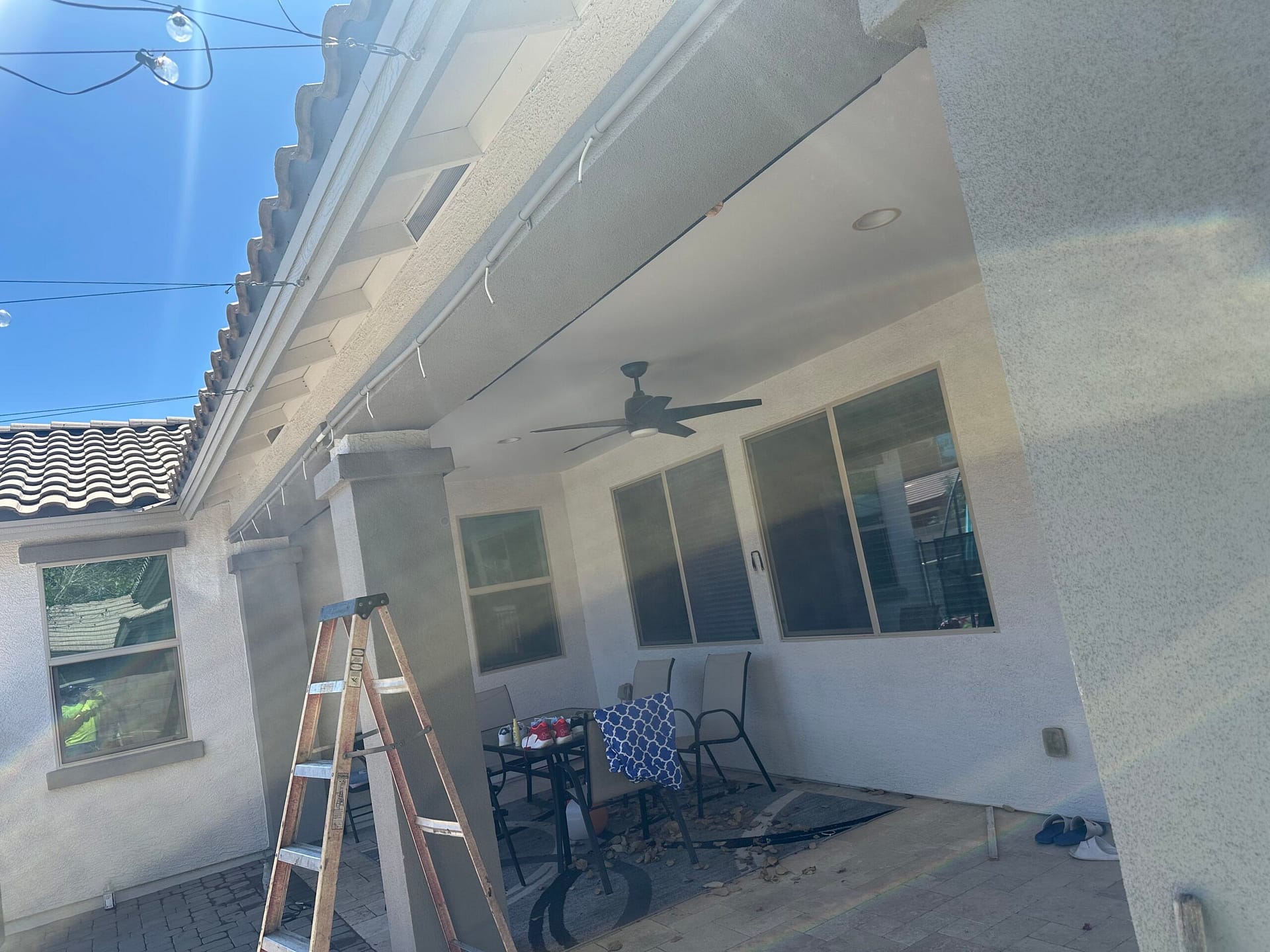 Breasy comparing a paint swatch to an HOA-approved color palette for a Scottsdale home