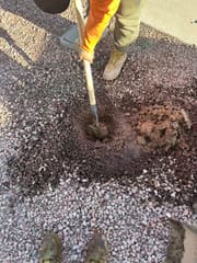 Replacing a broken drip emitter during a Scottsdale irrigation repair visit
