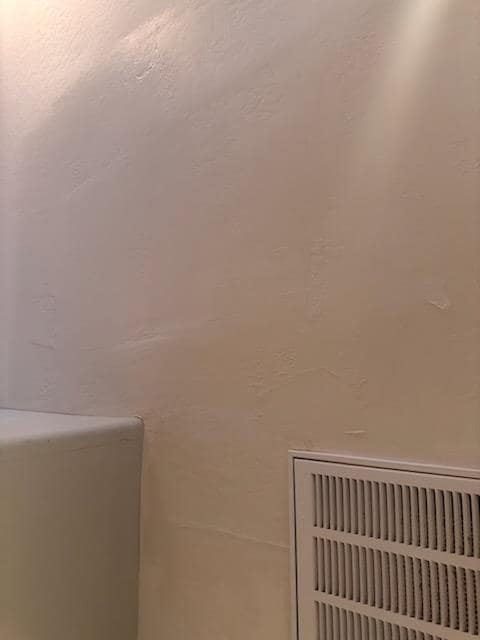 Freshly painted interior wall and ceiling corner at a Cave Creek property