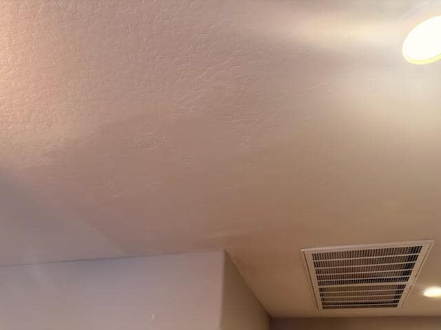 Freshly painted ceiling near an HVAC vent at a Cave Creek property