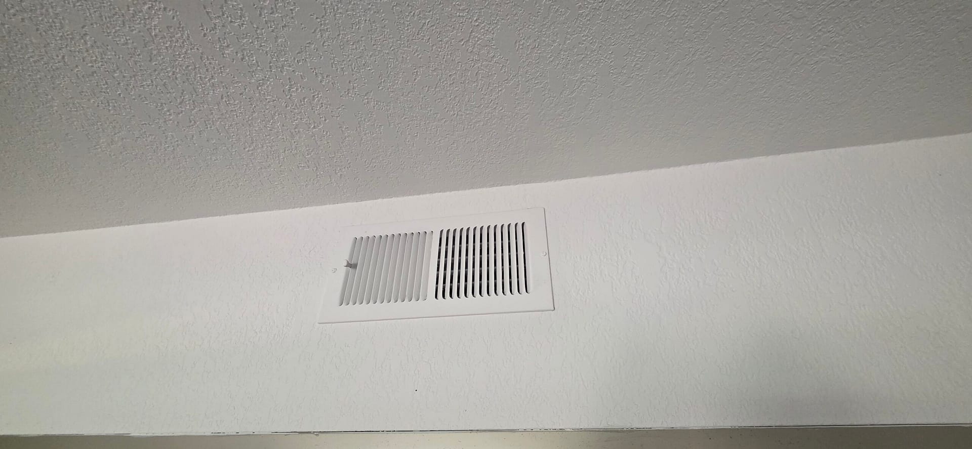 Newly cleaned supply vent grille after an HVAC maintenance visit in Cave Creek, AZ