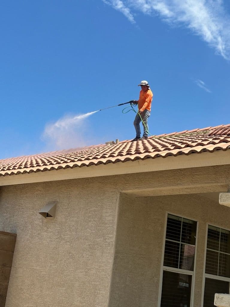 Breasy washing monsoon dust film off a Scottsdale stucco exterior