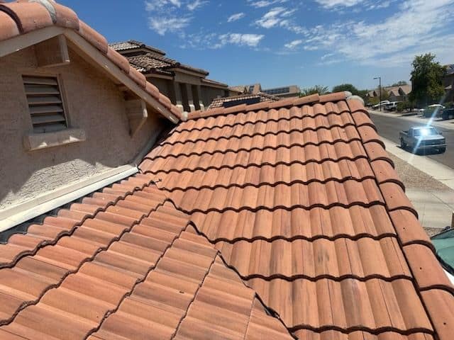 Cracked and chalking stucco exterior on a Scottsdale rental home before repaint