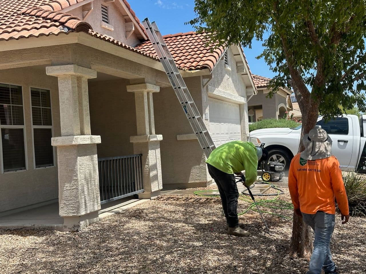Breasy pressure washing a driveway in Gilbert, AZ